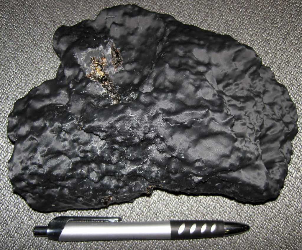 Thumbprint dents on an iron meteorite (replica)